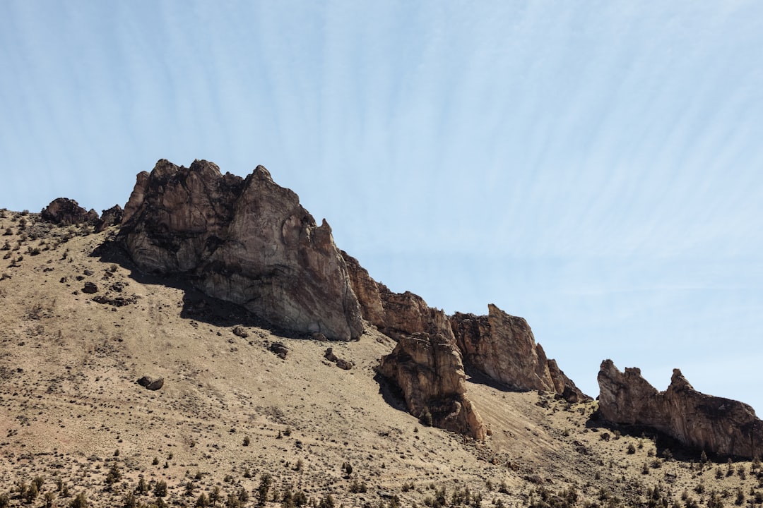 brown rocky mountain under blue sky during daytime