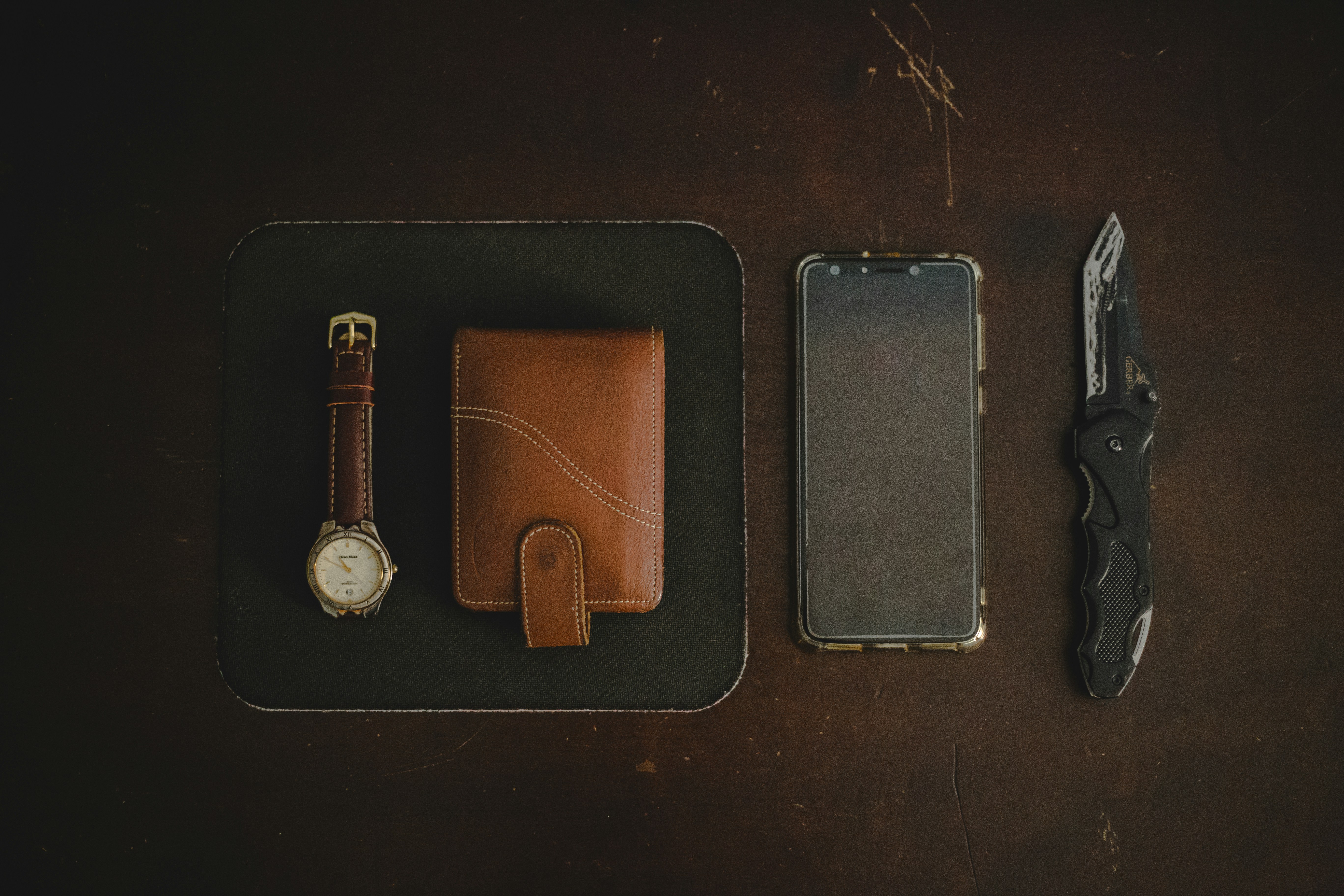 black and silver round analog watch