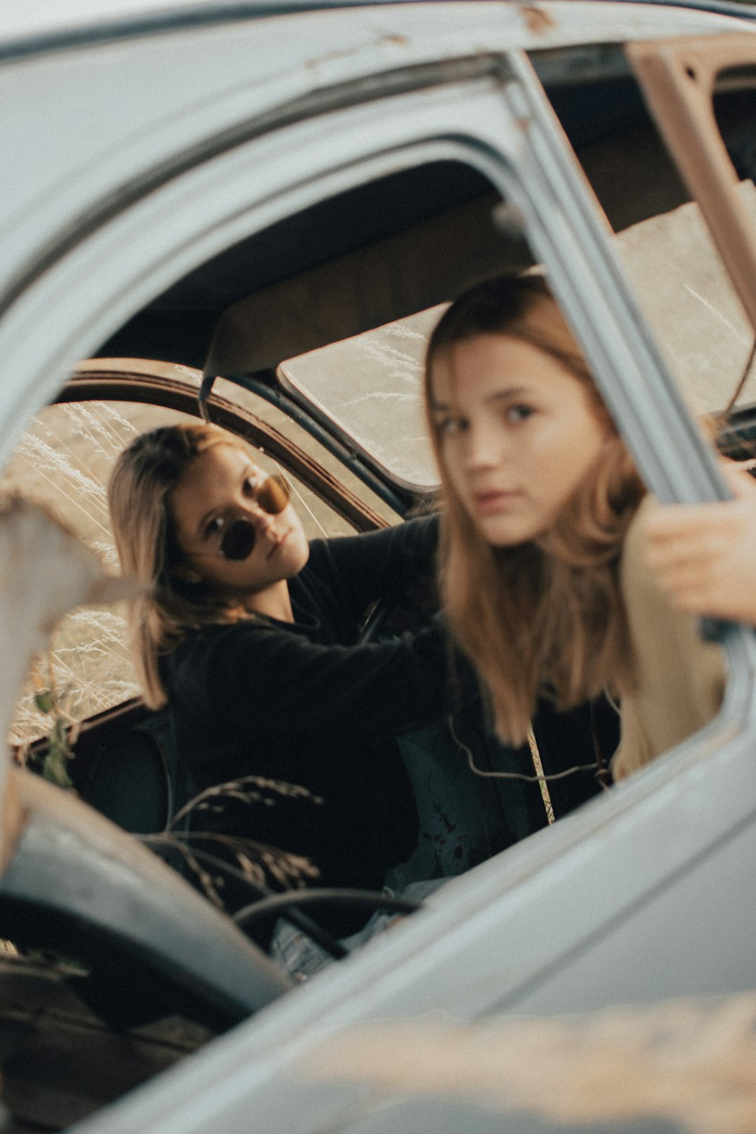 woman in black long sleeve shirt sitting inside car