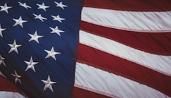 us a flag on white and red striped textile