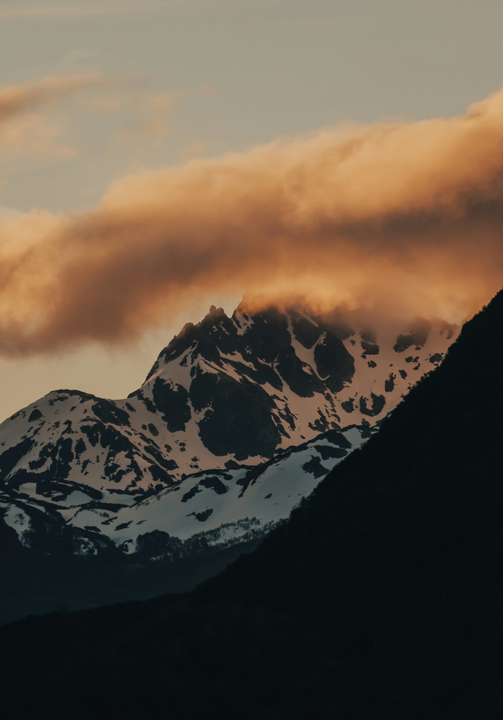 black and white mountain under cloudy sky during daytime