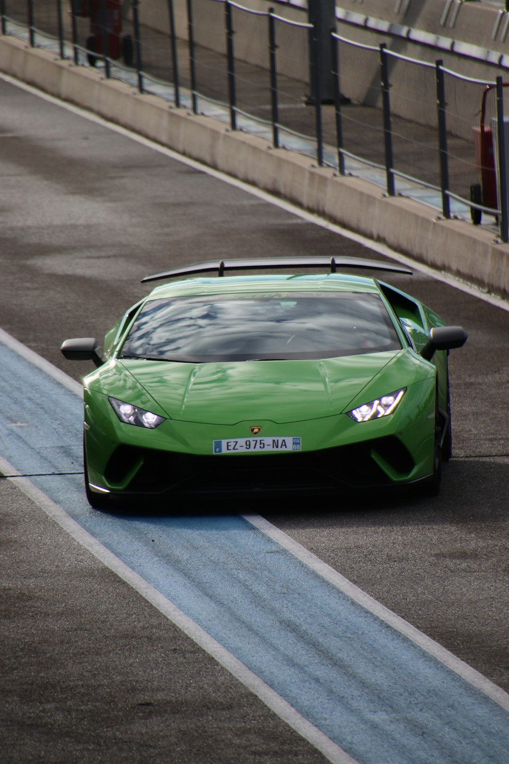 green porsche 911 on road during daytime