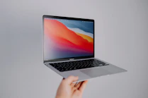 macbook pro on white table