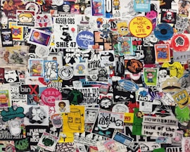 assorted stickers on white wall