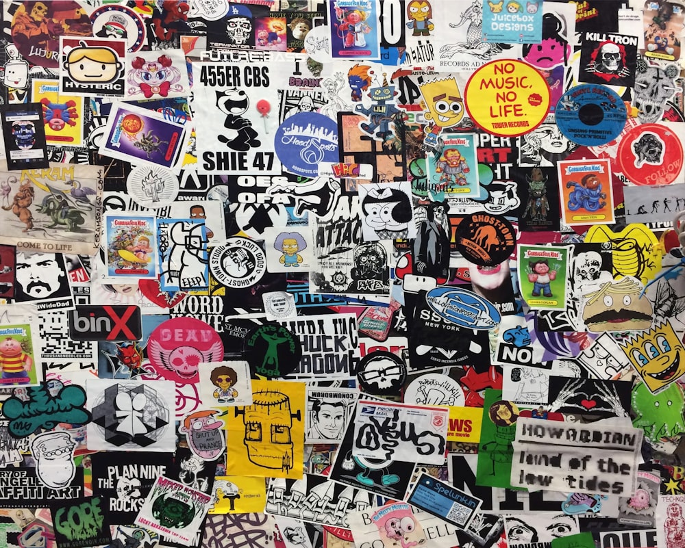 assorted stickers on white wall