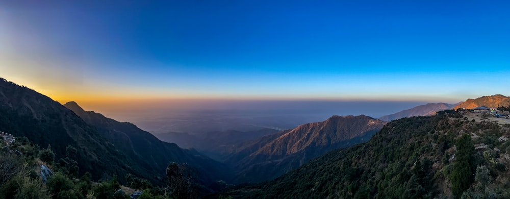 green mountains under blue sky during daytime