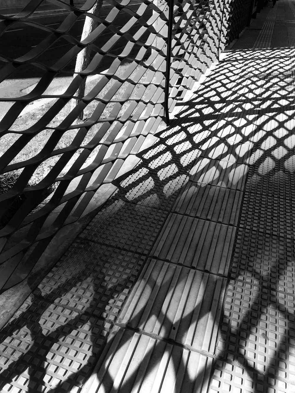 a black and white photo of a walkway