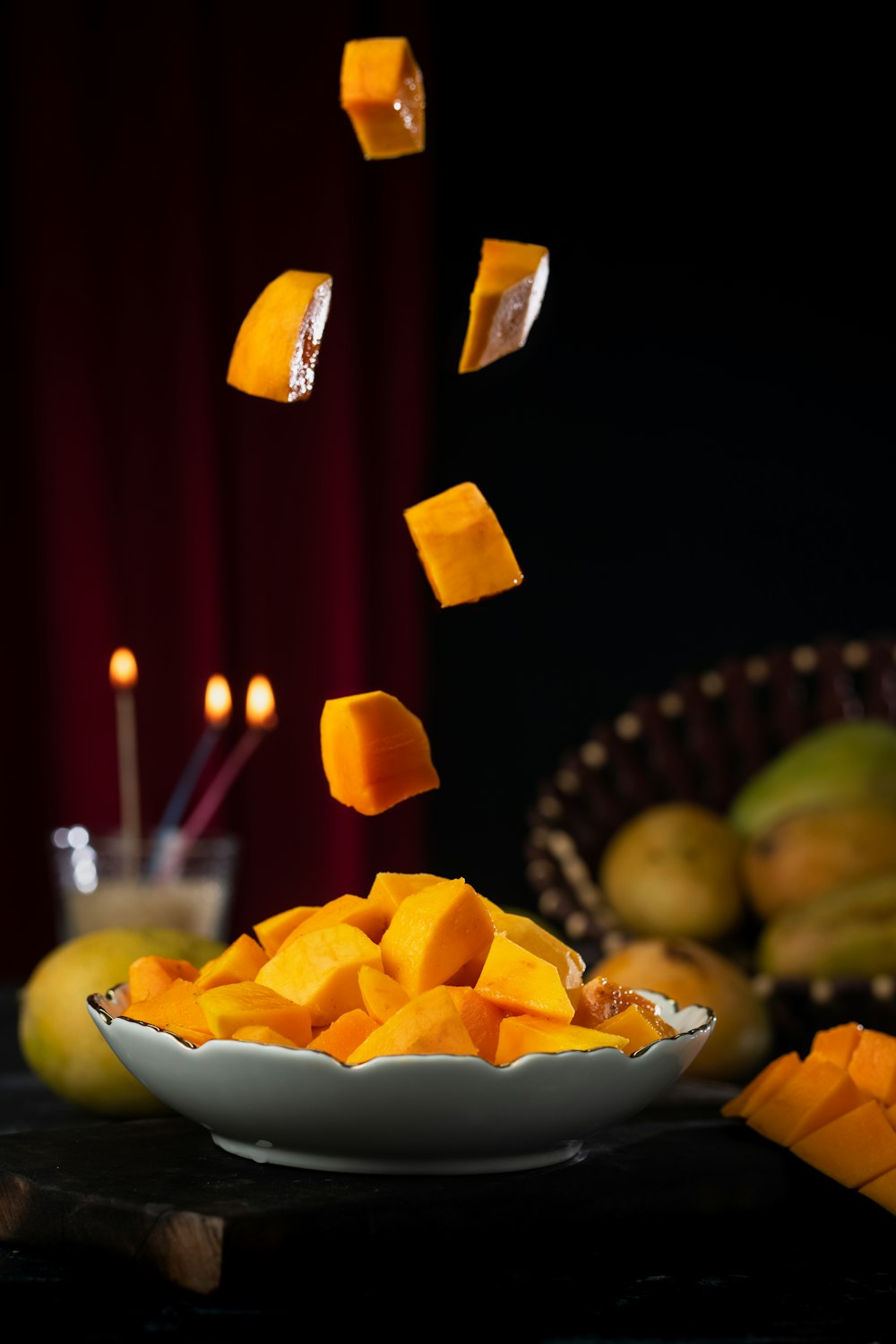 yellow candles on white ceramic bowl