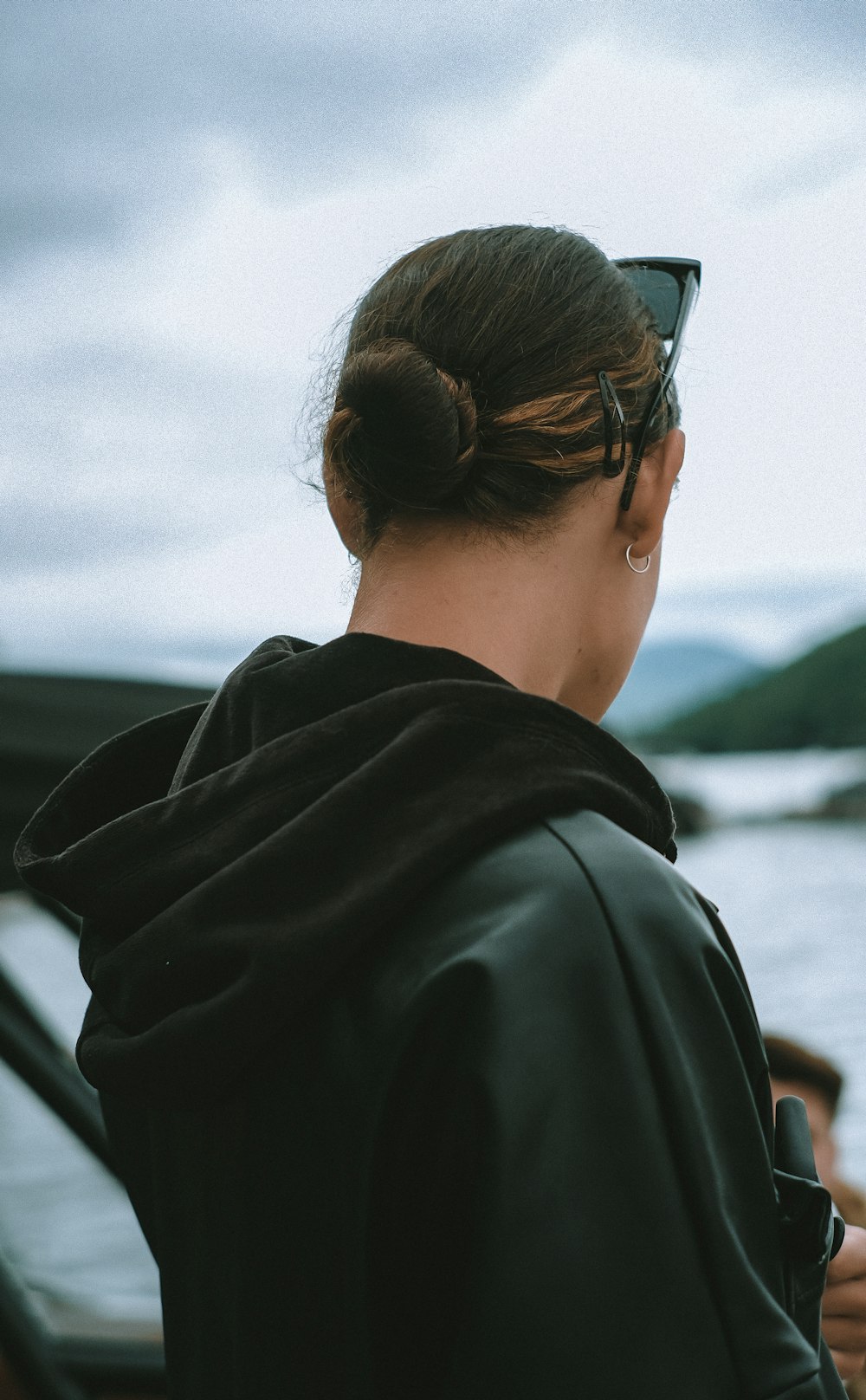 woman in black shirt looking at the sky during daytime