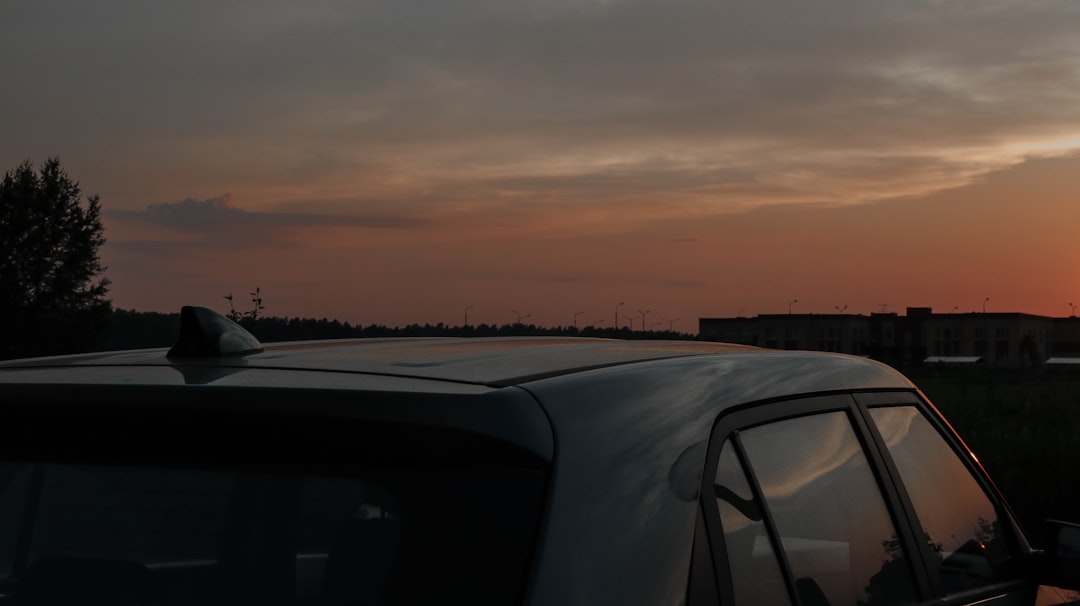 white car on road during sunset