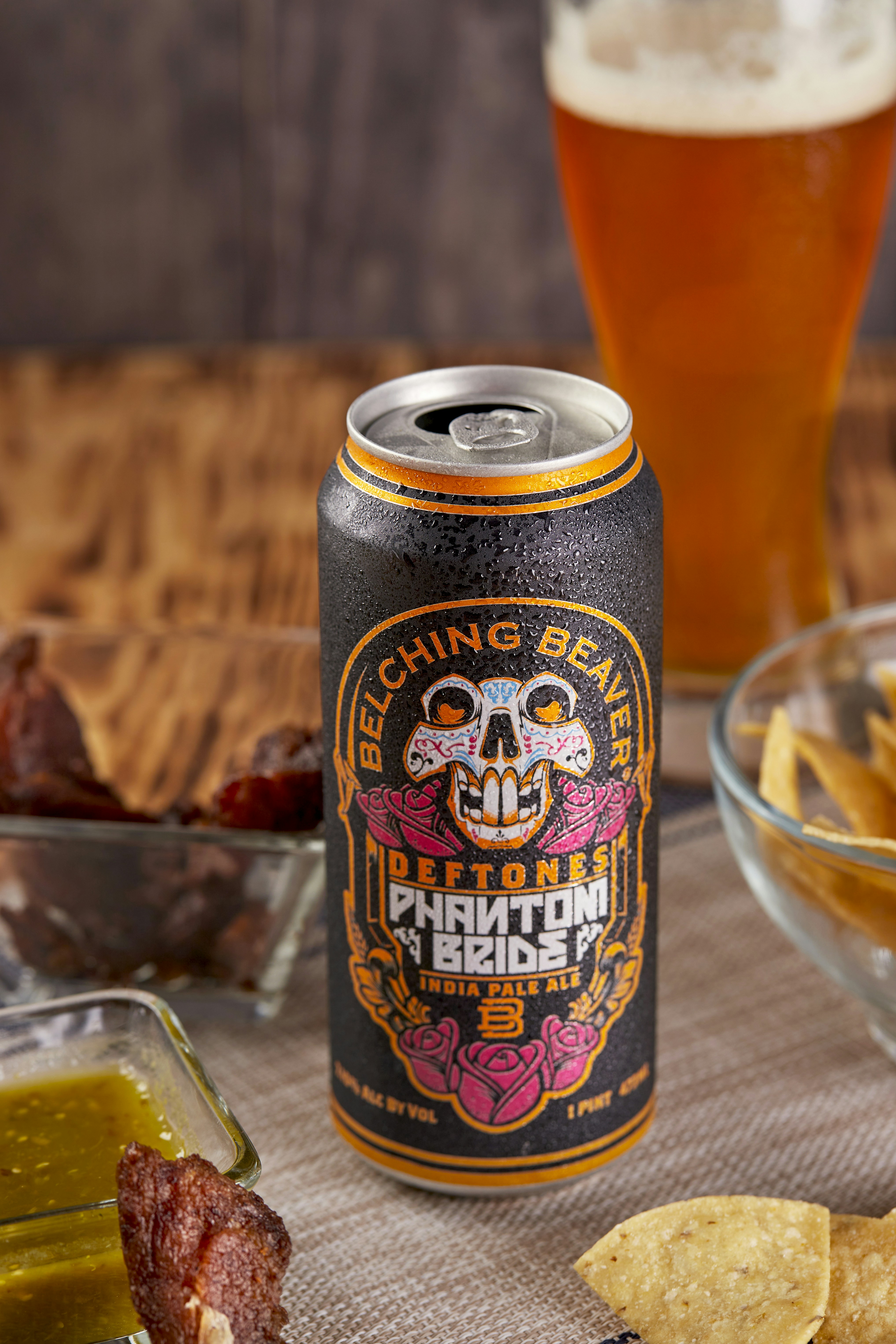 blue and yellow can on brown wooden table