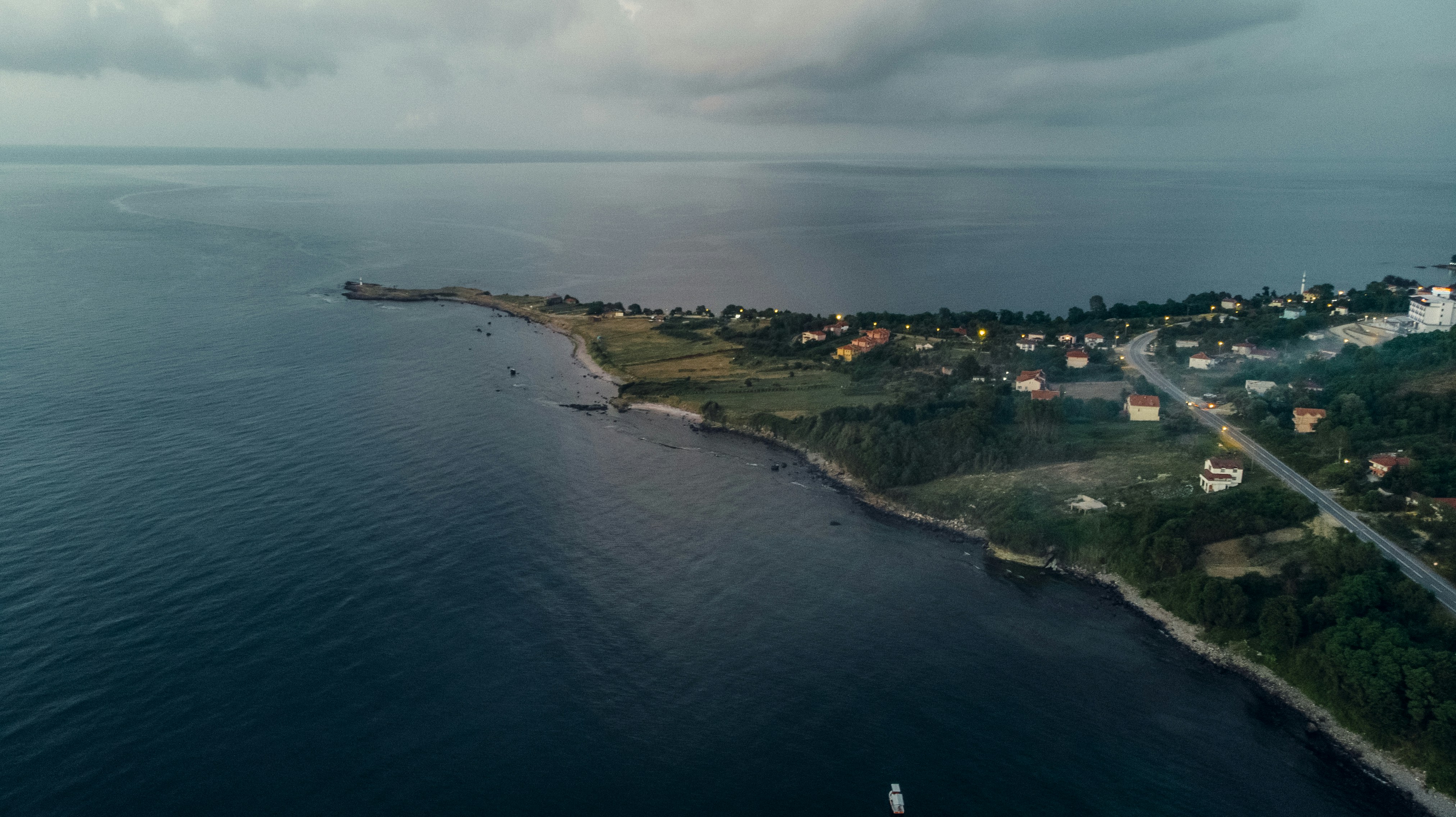 aerial view of city near body of water during daytime