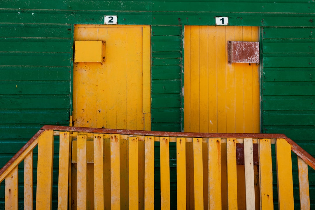 yellow and blue wooden fence