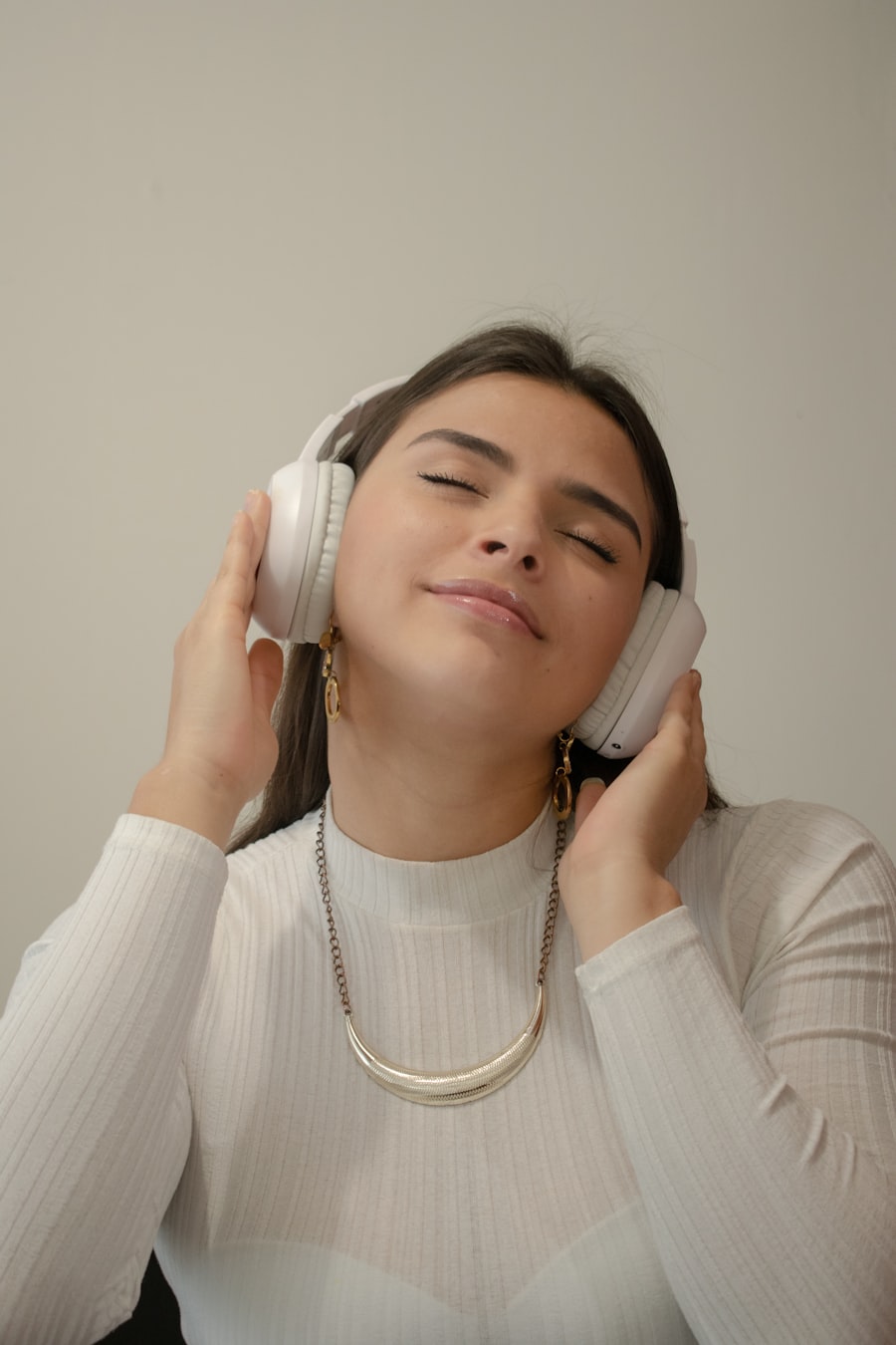 Person enjoying music with wireless headphones