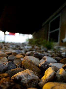 Close-up of a beautifully laid natural stone patio with intricate patterns and warm lighting.