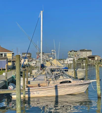 Exterior view of Advanced Marine Specialists' Davenport location under a clear blue sky.