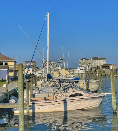 Exterior shot of the Advanced Marine Specialists Davenport location with boats docked nearby under a clear sky.