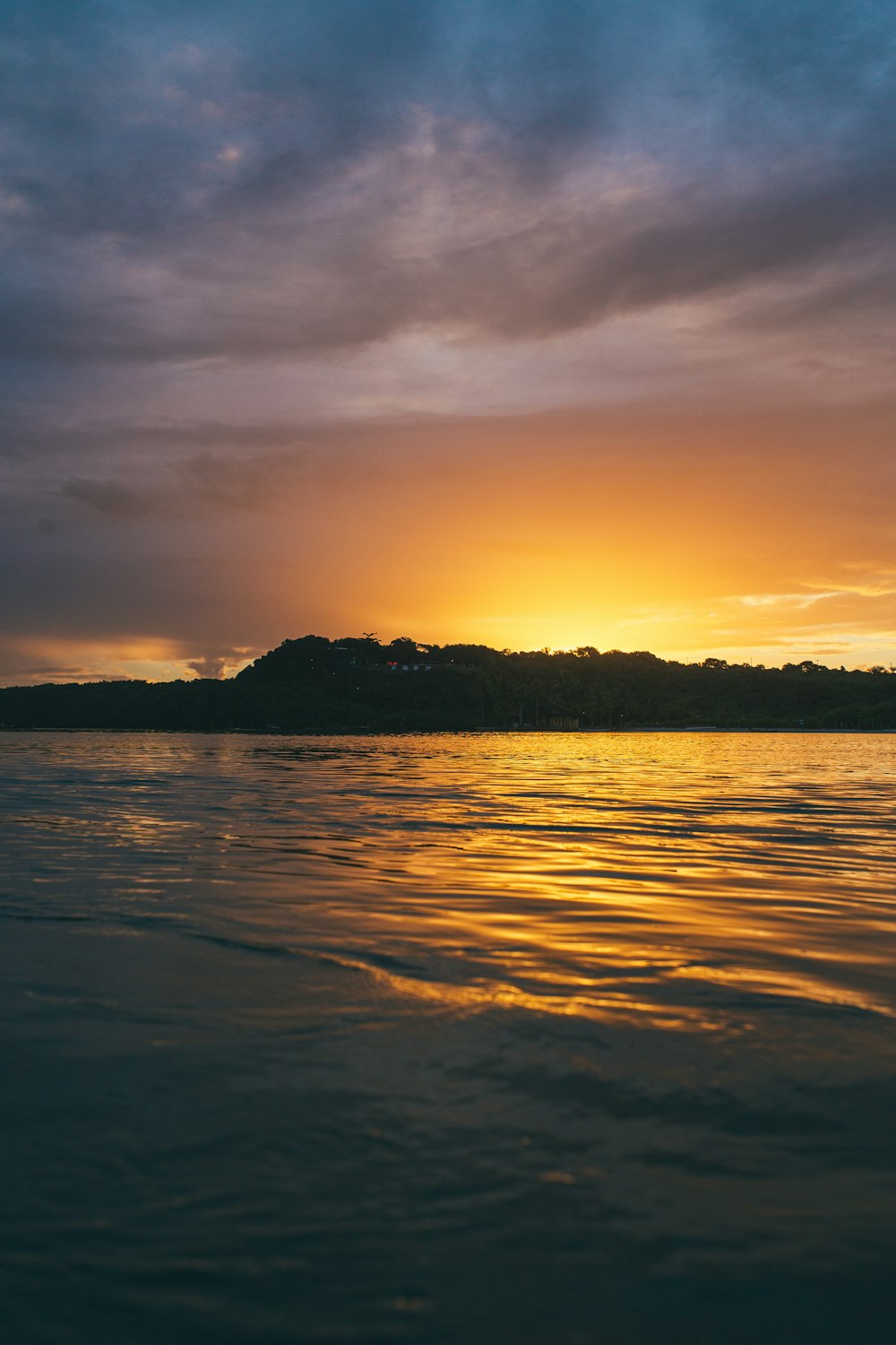 body of water during sunset