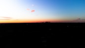 A scenic city skyline at sunset, symbolizing romance and new connections.