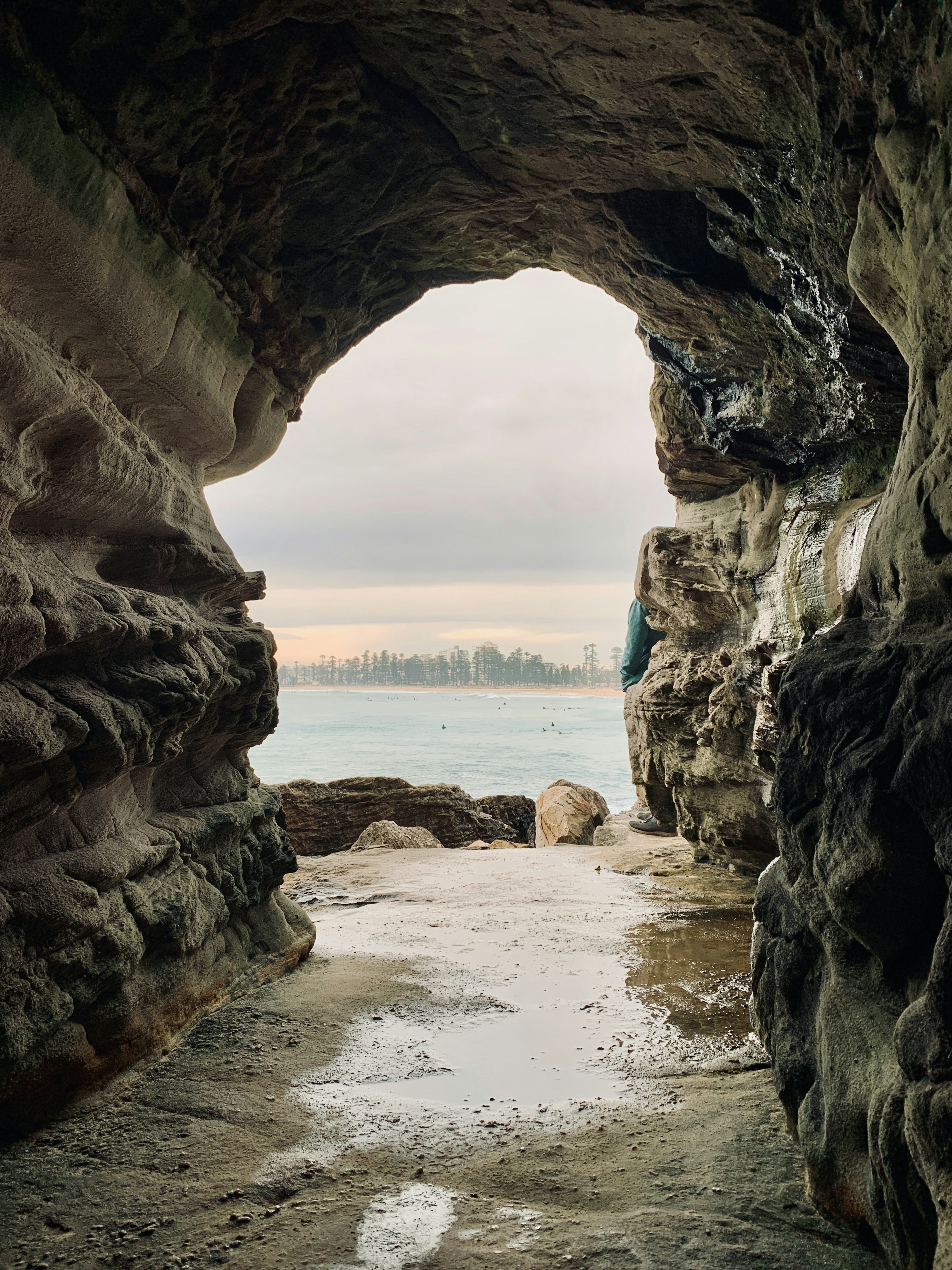 brown rock formation on beach during daytime