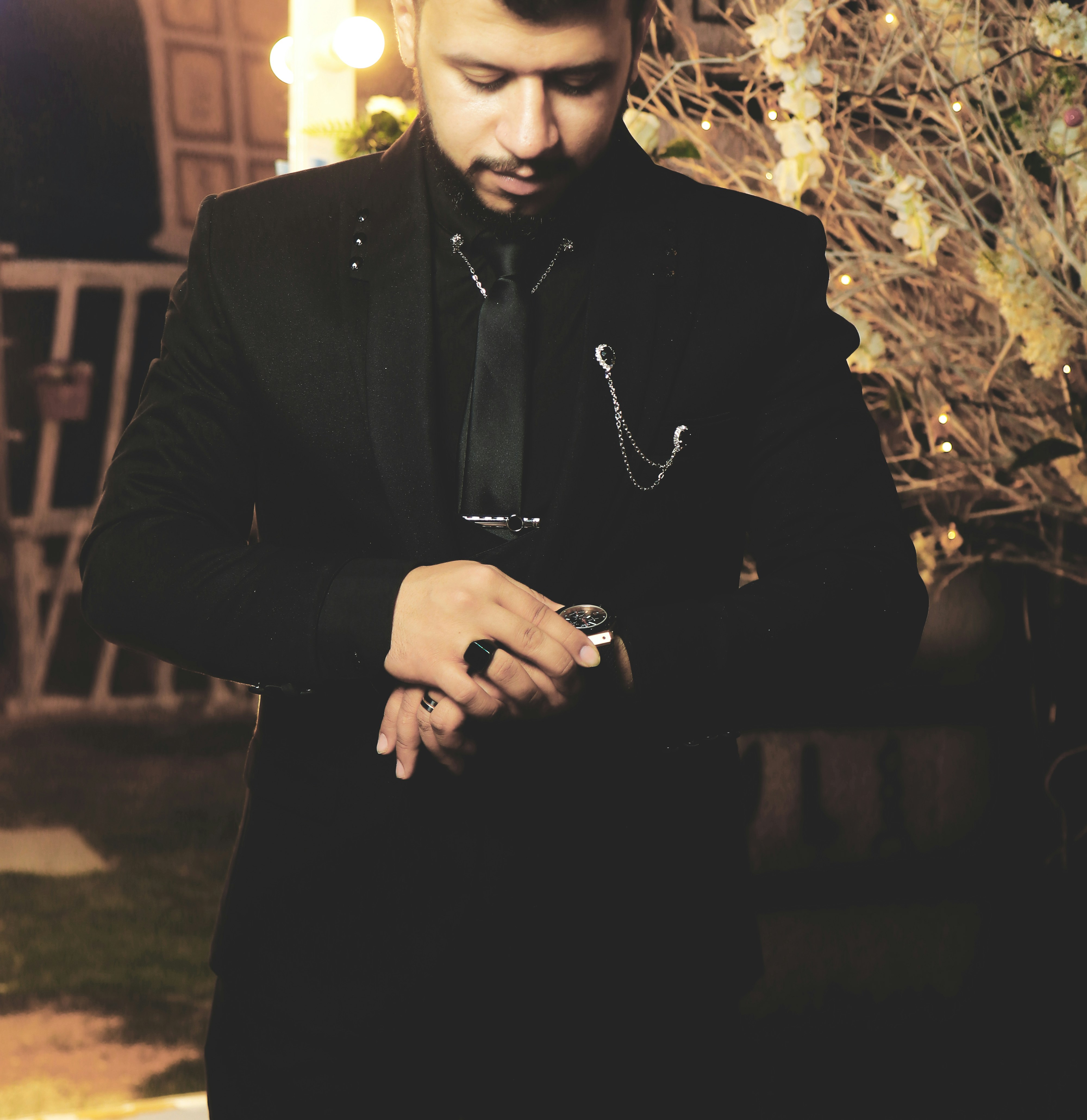 man in black suit jacket wearing black sunglasses