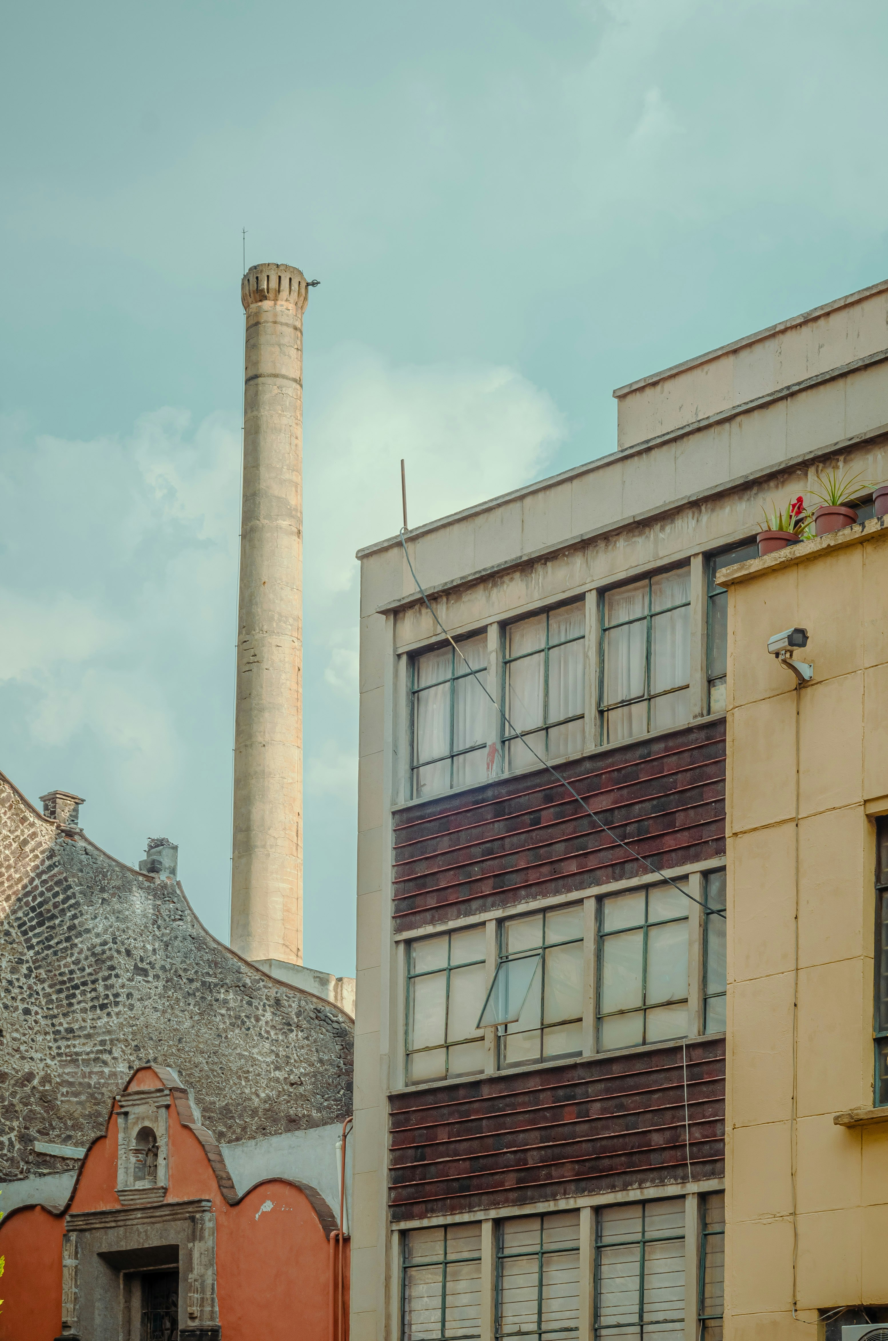 brown brick building under white sky during daytime