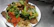 A vibrant plate of stir-fried vegetables topped with a generous dollop of Numbnumbs Hot Chili Crisp.
