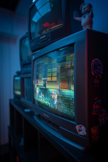 black crt tv turned on in a room