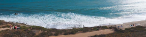 A serene beach scene with visitors relaxing during a PesonaNusa tour