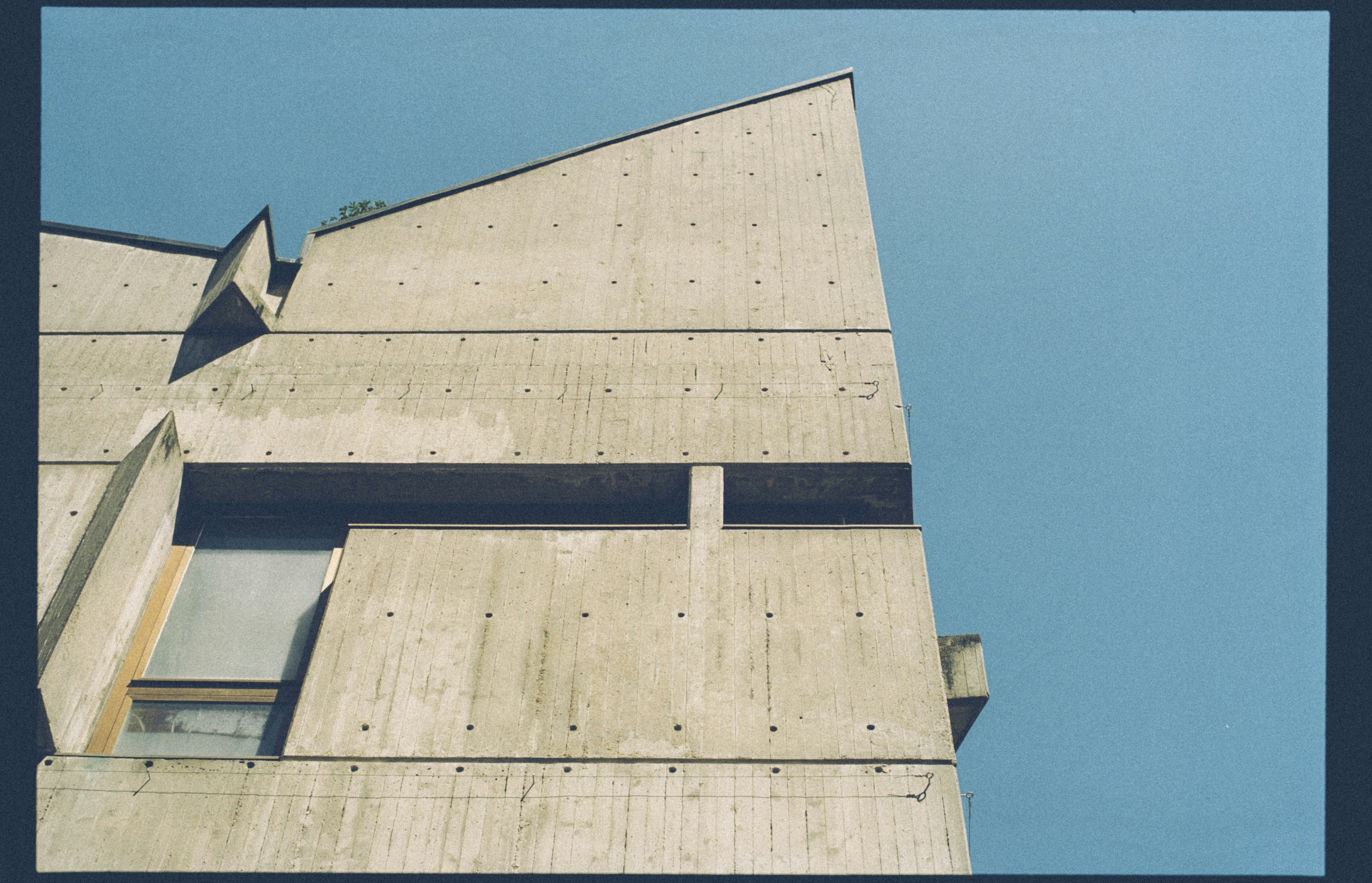 brown wooden wall under blue sky during daytime