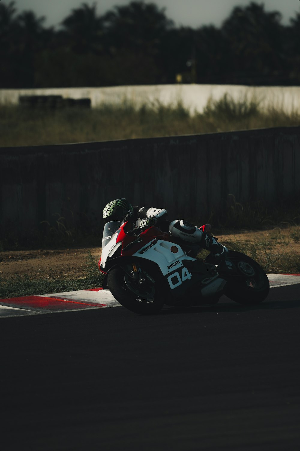 white and black sports bike on road during daytime