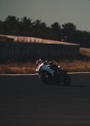 High-speed shot of a motorcycle racer leaning into a sharp turn