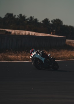 High-speed shot of a motorcycle racer leaning into a sharp turn