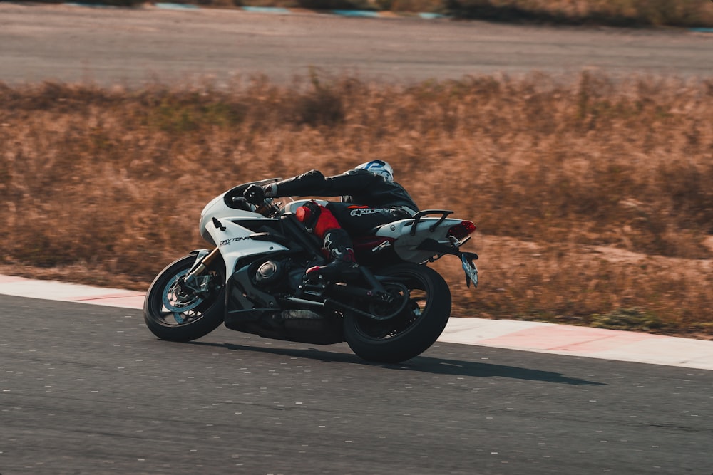 black and white sports bike on road during daytime