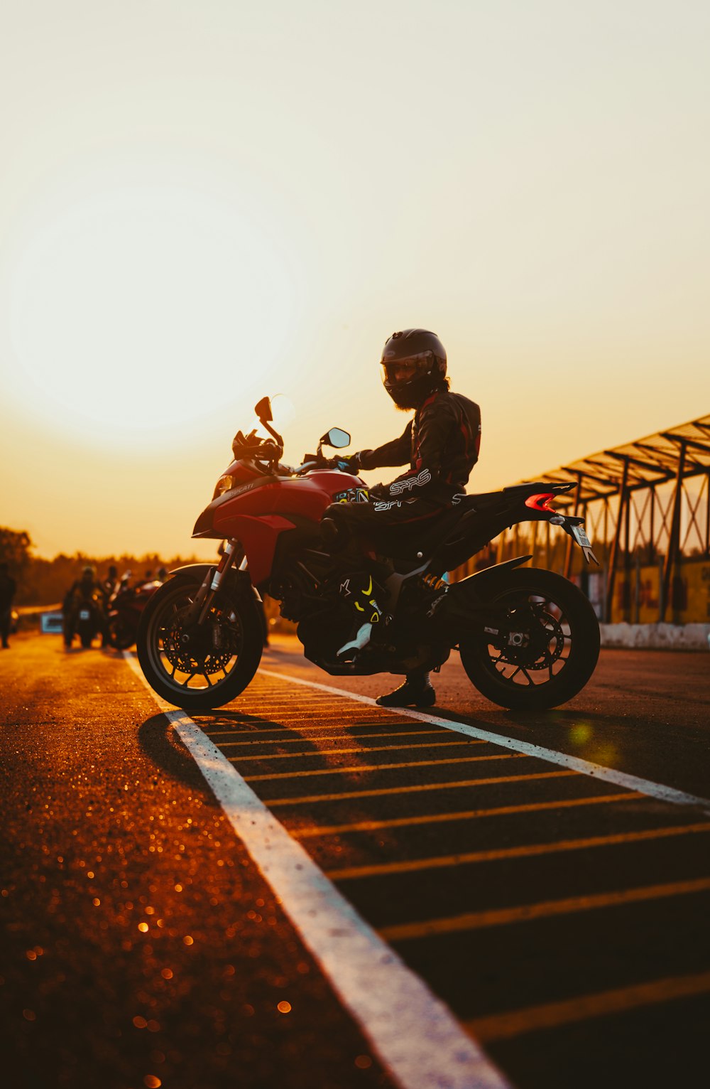 man in black jacket riding motorcycle during daytime