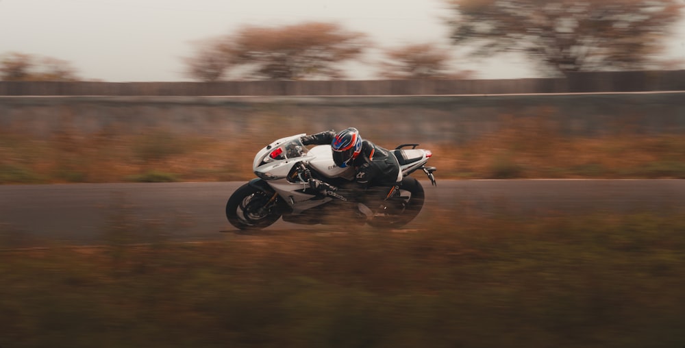 white and black sports bike on track field