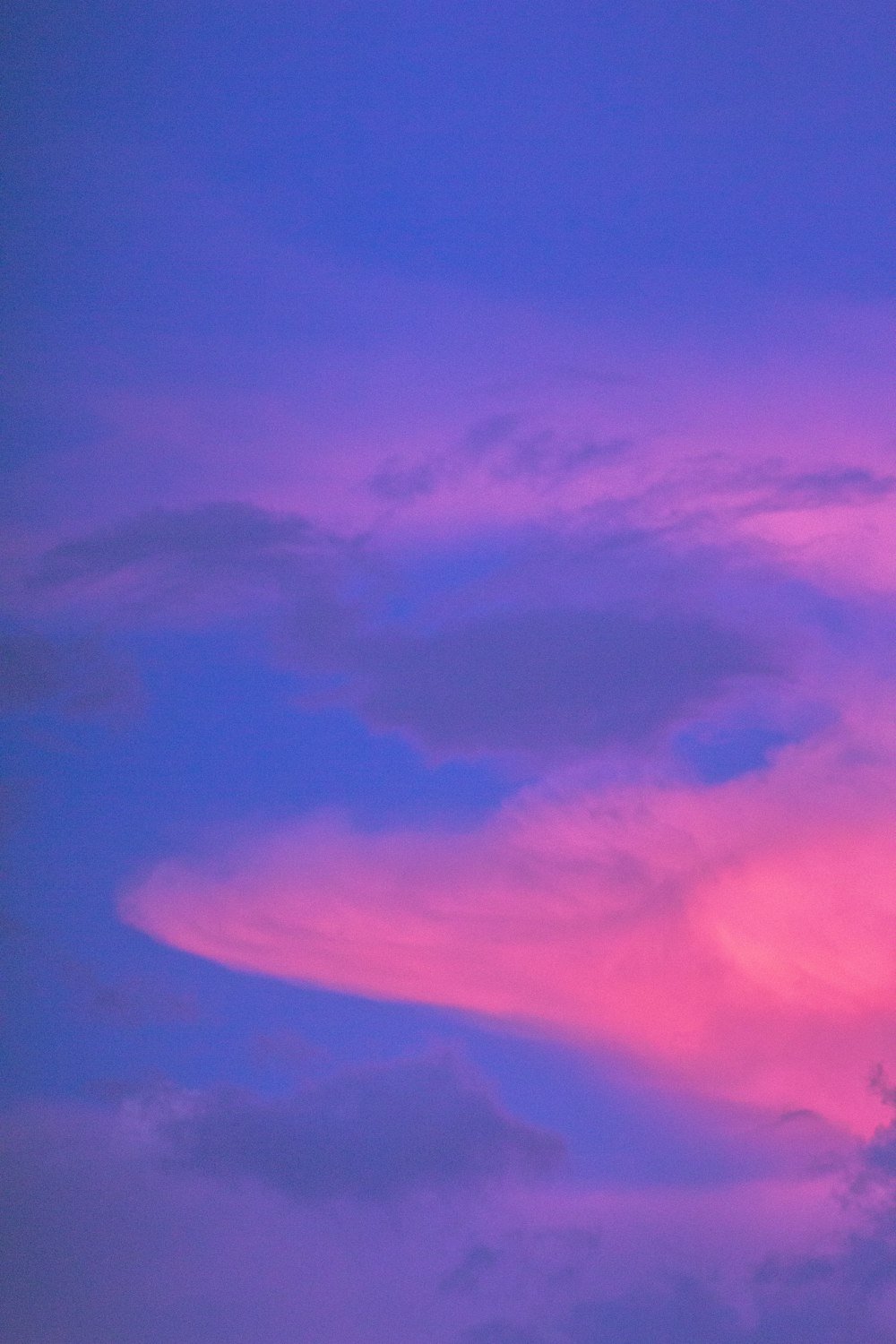 purple and pink clouds during night time