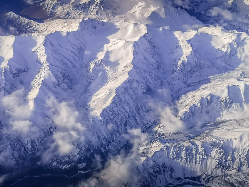 snow covered mountain during daytime