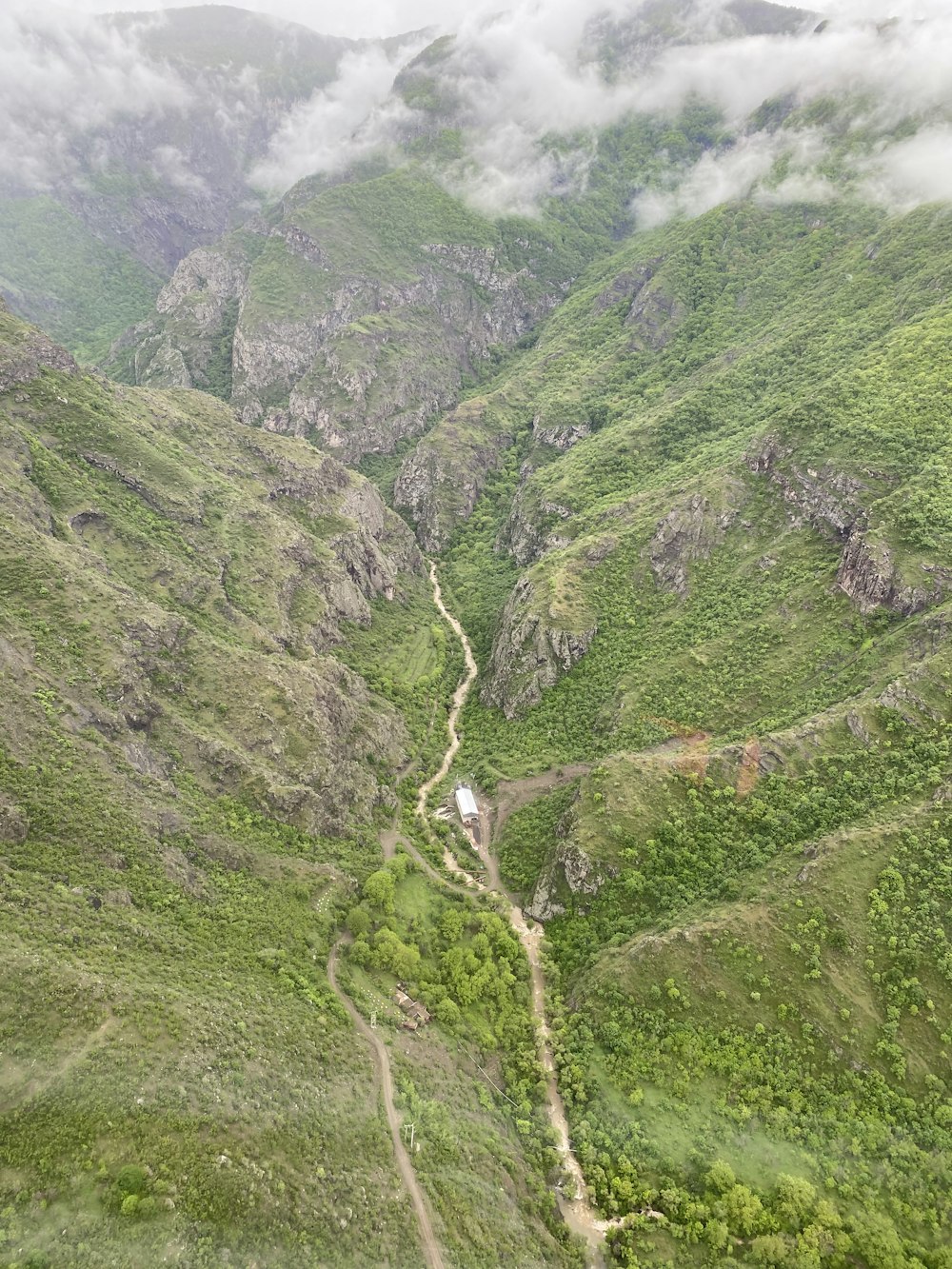 green and gray mountains under white sky during daytime