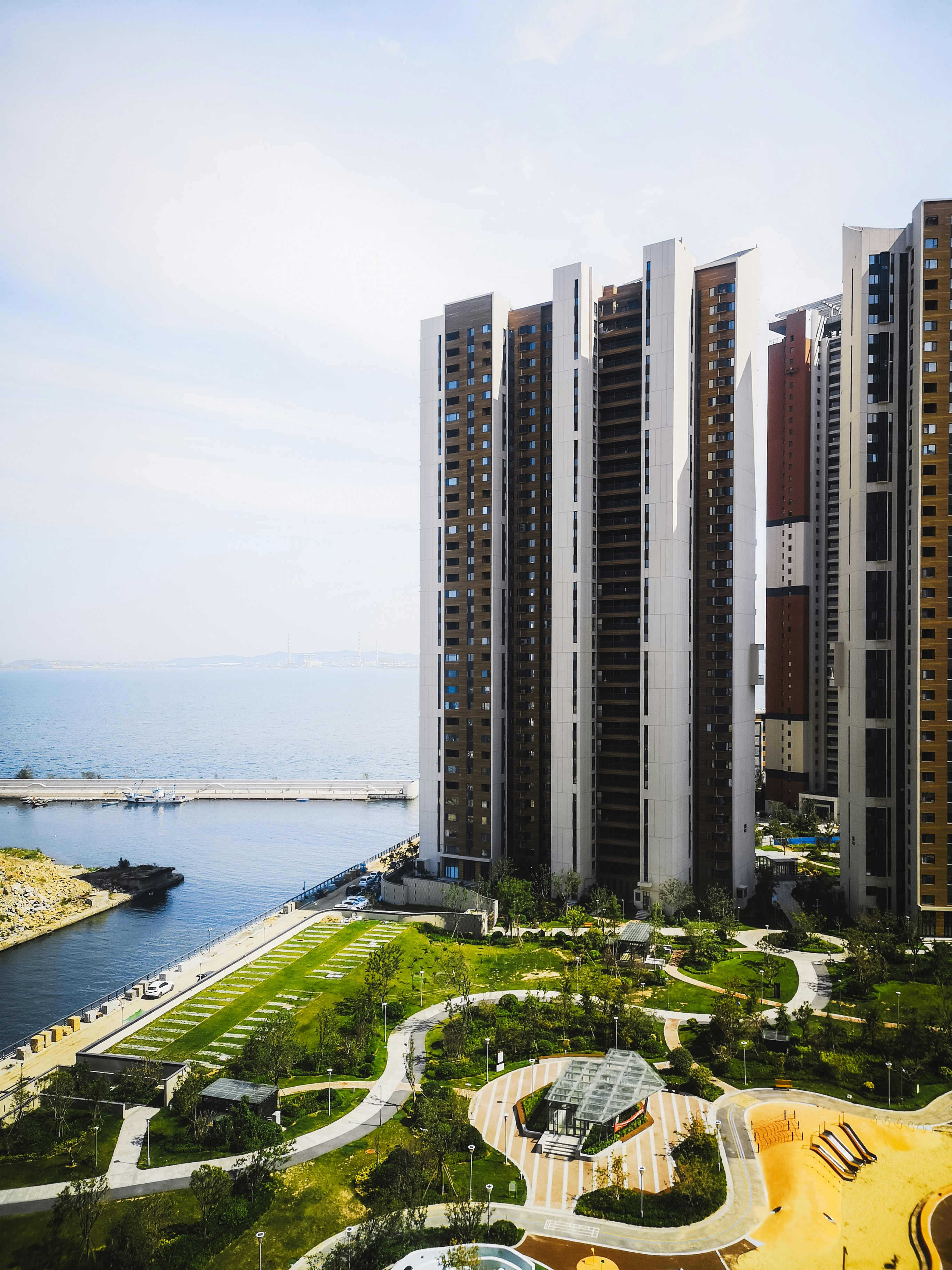 high rise buildings near body of water during daytime