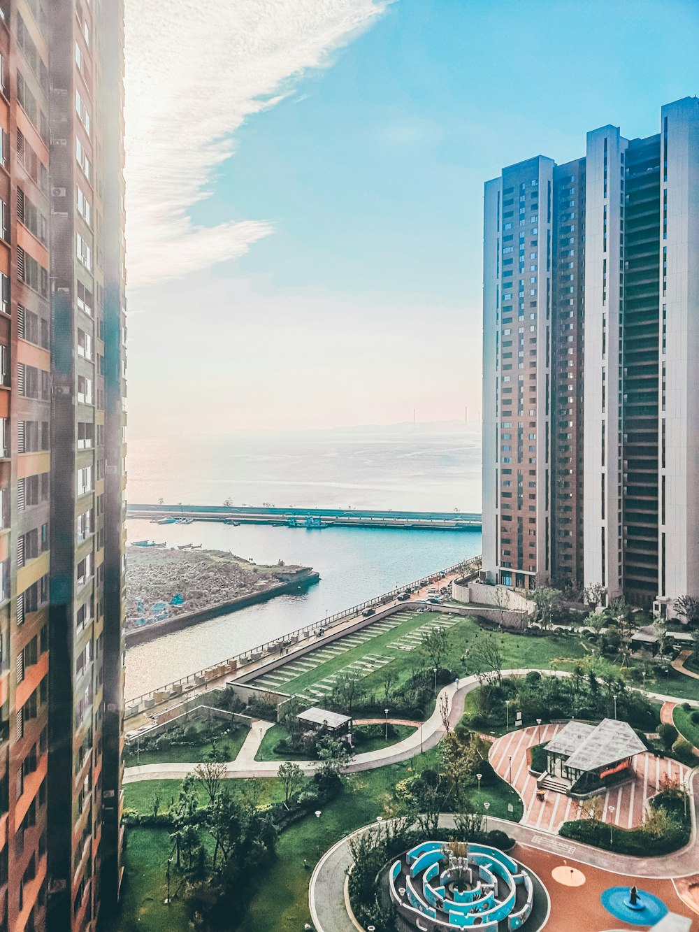 high rise buildings near body of water during daytime