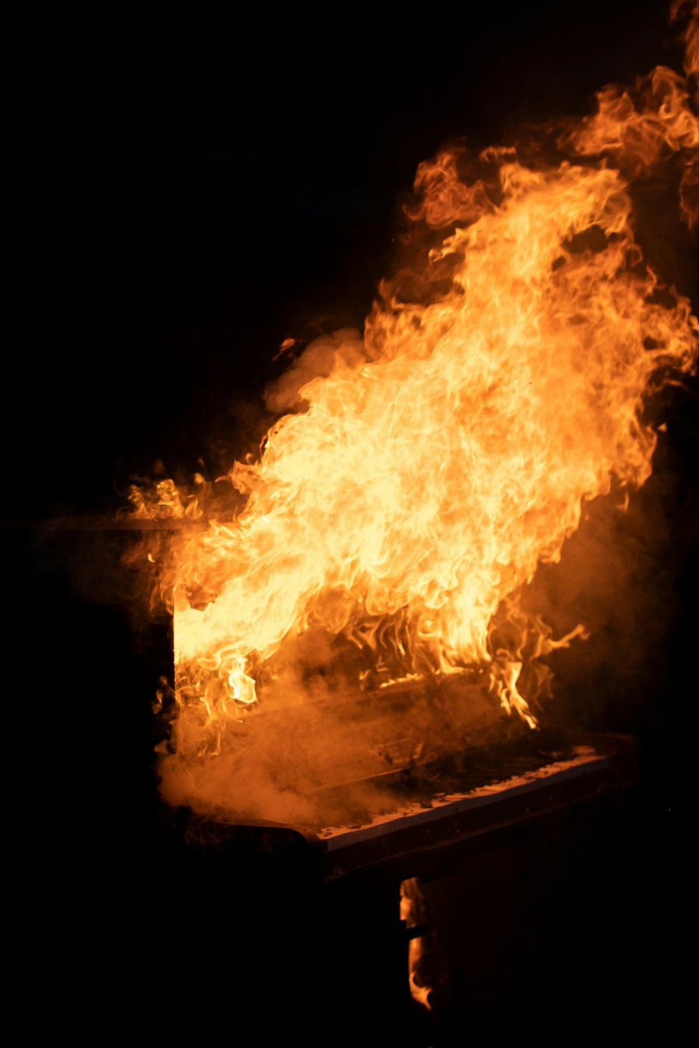 fire on brown wooden table