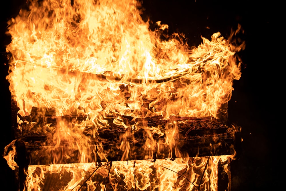 fire on brown concrete wall