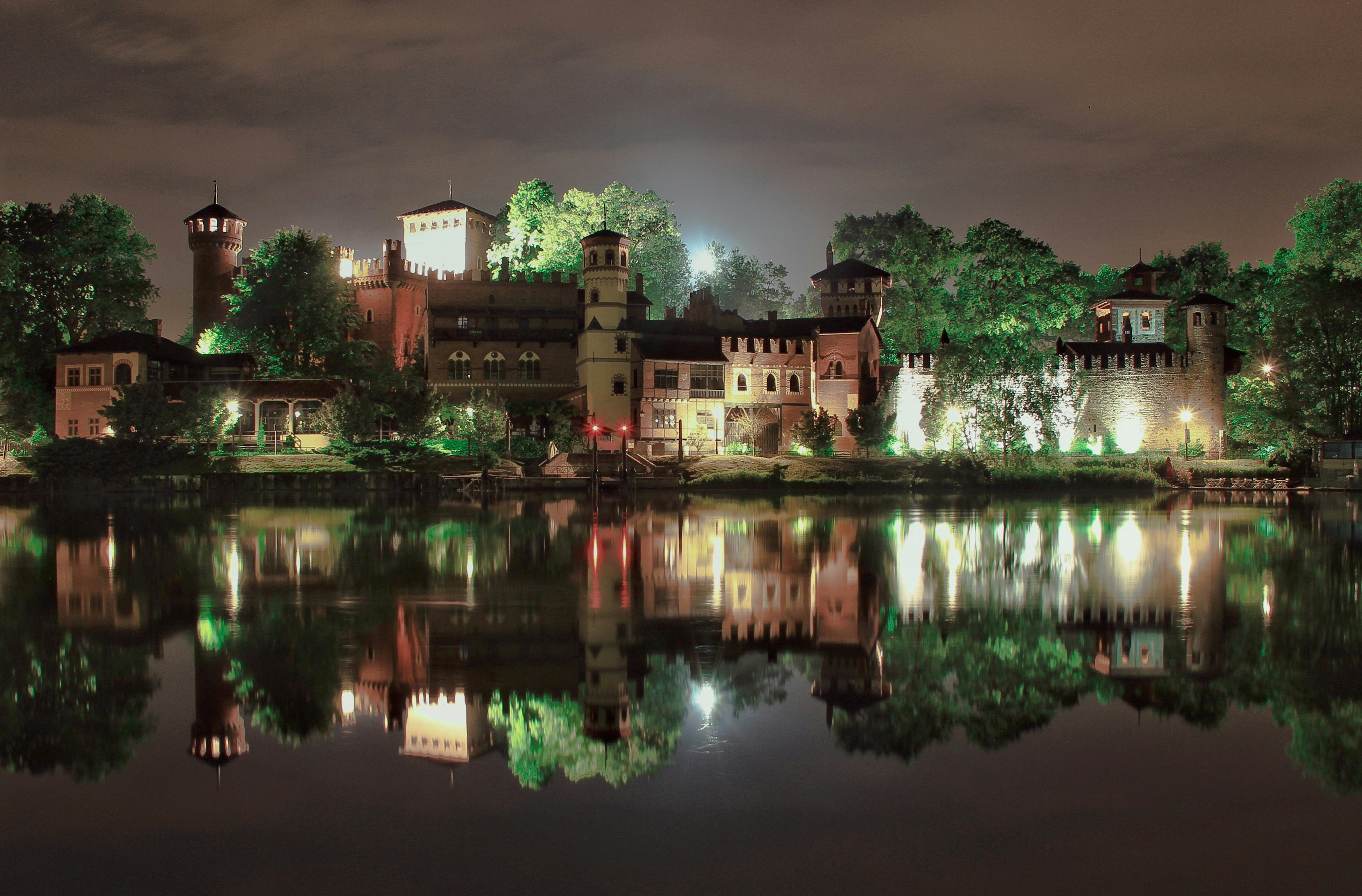 brown concrete building near body of water during daytime
