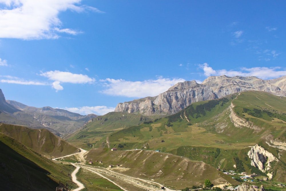 green and brown mountains under blue sky during daytime