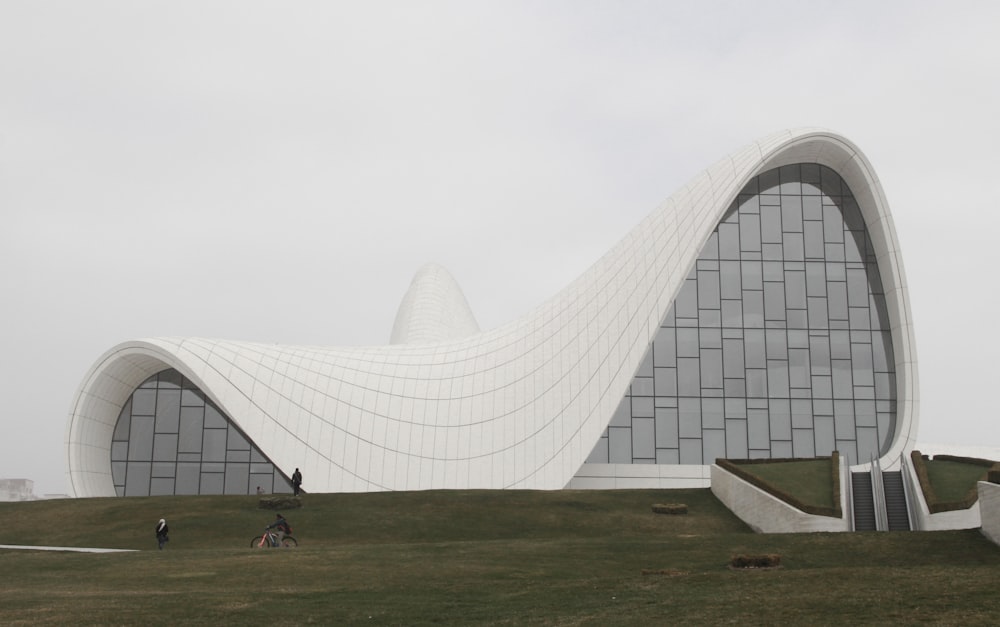 white building near green grass field during daytime