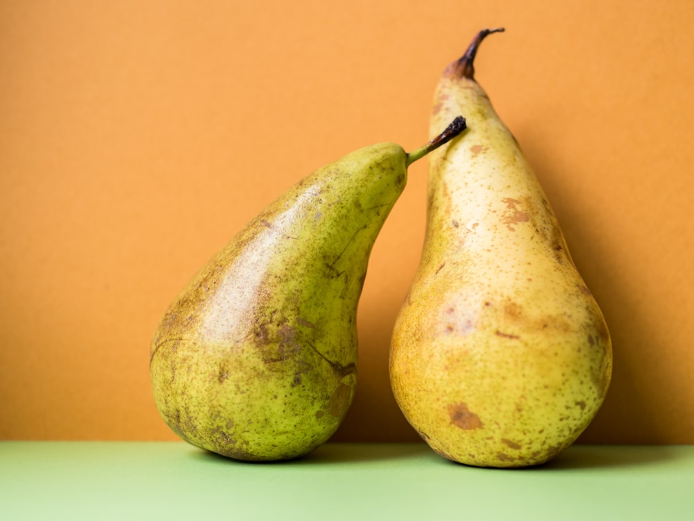 two green and yellow oval fruits