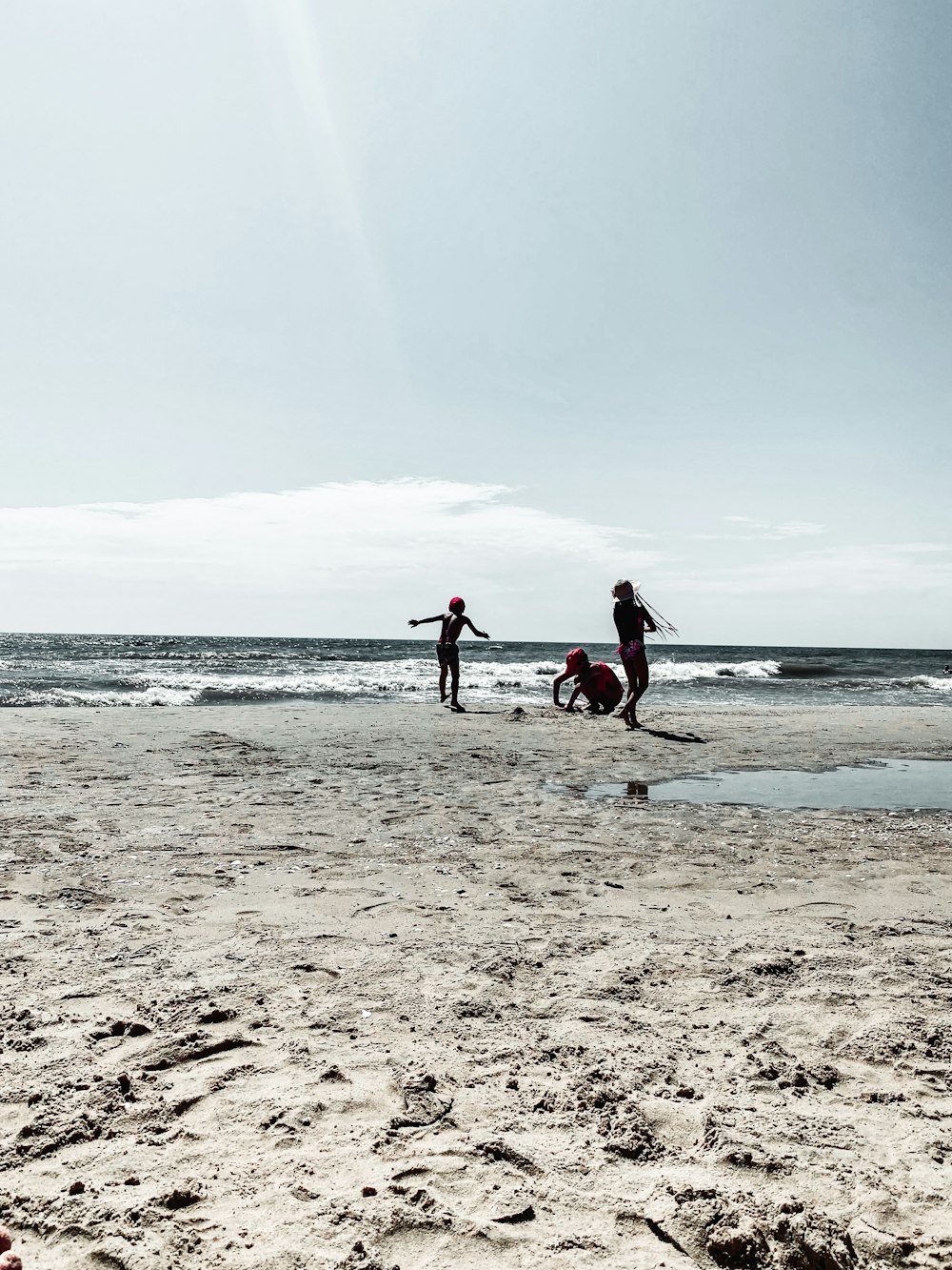 2 person walking on beach during daytime