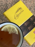 A cozy kitchen setting with Glucotex Danmark sachets and a cup of tea nearby