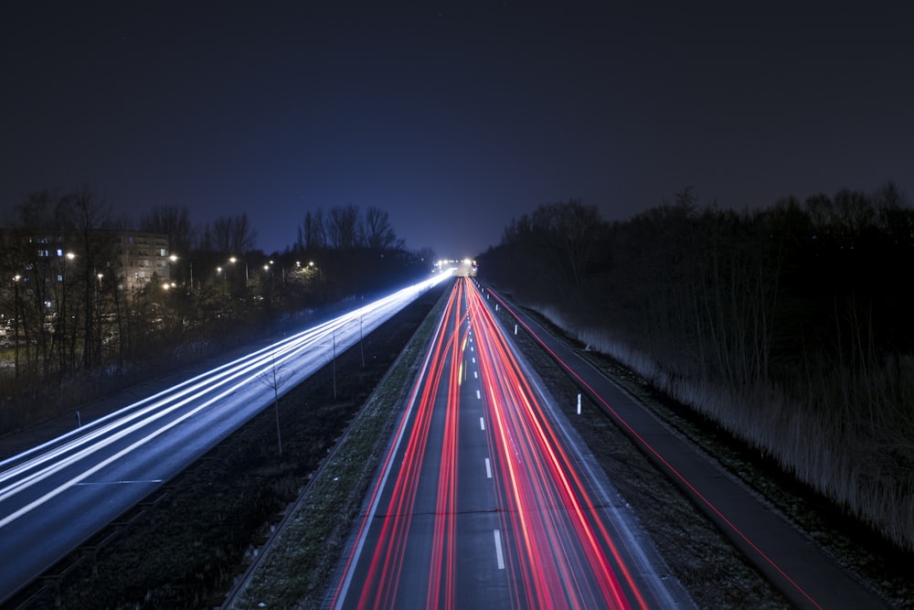 time lapse photography of cars on road during night time